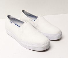 Keds Triple Decker canvas shoes for women. The shoes are like-new but with a defect. There is a stain mark on the heel of one of the shoes. See pictures. Ships in a generic shoe box. Canvas Shoes Women, Shoes White, Shoes For Women, Shoe Box, Keds, Canvas Shoes, On Shoes, Slip On Shoes, Comfortable Shoes