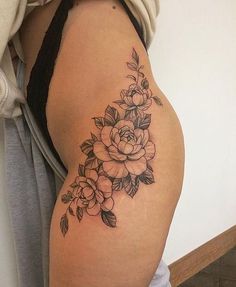 a woman's thigh with flowers on it