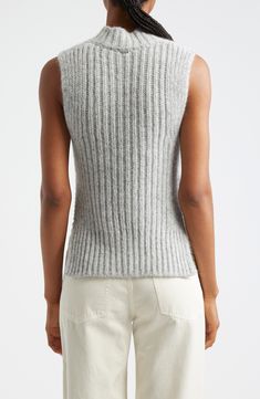 The Italian label's signature blend of relaxation and luxury shines in this alpaca-kissed sweater-tank boasting ribbed edges and an ornate openwork body. Mock neck Side slits 48% alpaca, 23% metallic fibers, 21% polyamide, 8% wool with 55% cotton, 45% polyester contrast Dry clean or machine wash, dry flat Made in Moldova Designer Clothing Mohair Tops For Fall, Elegant Merino Wool Textured Knit Top, Knitted Mohair Tops, Fitted Fine Knit Sleeveless Sweater, Fitted Sleeveless Fine Knit Sweater, Luxury Chic Merino Wool Knit Top, Fine Knit High Neck Merino Wool Top, Fine Knit Mohair Tops, Luxury Fine Knit Merino Wool Top