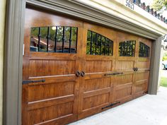 an image of a wooden garage door with windows