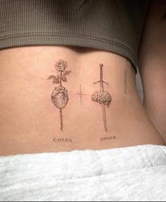 a woman's stomach with two different tattoos on her side and the words chaos order