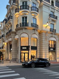 a black car parked in front of a building