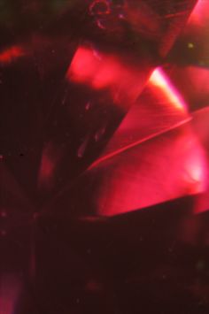 a close up view of some red crystals