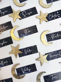 gold stars and moon place cards with names on them