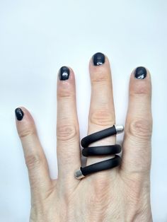 Dark modern simple ring, which can be customized.  The ring is very comfortable and flexible.  This unusual twisted ring is a great gift for someone who loves mystery and gothic jewelry I like to combine different types of materials, which with a lot of imagination give contemporary, avant-garde, unusual jewelry.    MATERIALS : - Aluminum wire 2.5 mm - Rubber tube - Silver plated metal ends The package will be sent as soon as possible (1-3 days) after purchase. Feel free to contact me if you hav Minimalist Spiral Rings For Everyday, Minimalist Everyday Spiral Rings, Modern Twist Spiral Stackable Rings As Gift, Modern Adjustable Rings With Unique Design, Modern Adjustable Ring With Unique Design, Modern Spiral Rings As A Gift, Modern Spiral Rings As Gifts, Adjustable Spiral Rings With A Modern Twist, Adjustable Spiral Ring With A Modern Twist