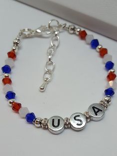 "USA Bracelet This darling USA bracelet is fun conversation jewelry and would make perfect festival jewelry. Trendy Jewelry is both fun jewelry and makes great gifts for her. Holiday bracelets help make the day special and this piece is a sweet reminder that Americana gifts are great way to show American Pride. Bracelet is 6 1/2\" with a 1 1/2\" extension. The stamped silver colored beads are double sided. This listing is for the Bracelet ONLY Hypoallergenic to eliminate irritation/ Excellent cu Cute Nickel-free Charm Bracelet For Friendship, Nickel-free Charm Bracelet For Friendship On Valentine's Day, Nickel-free Charm Bracelet For Valentine's Day Friendship, Valentine's Day Nickel-free Charm Bracelet For Friendship, Fun Silver Jewelry For Friendship, Cute Nickel-free Charm Bracelet For Birthday, Novelty Personalized Bracelets For Best Friend, Personalized Novelty Bracelets For Best Friend, Novelty Personalized Friendship Bracelets