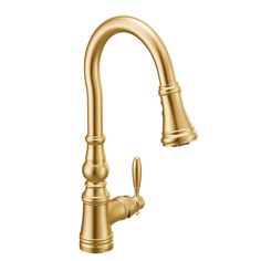 an image of a kitchen faucet in gold