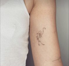 a person with a small tattoo on their arm