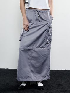 Soft and drapery, this loose fitting skirt features 2-way silhouette with detachable zip panel. It is accentuated with wide cargo pockets at sides for a trendy mood. - Sleek satin fabric- Midi and maxi lengths- Banded waist with adjustable string and stopper detail- Eyelet cargo pocket with logo label- Deep slit detail at back hem Fitting Skirt, Cargo Skirt, Satin Maxi, Logo Label, Cargo Pocket, Steel Grey, Gray Skirt, 2 Way, Satin Fabric