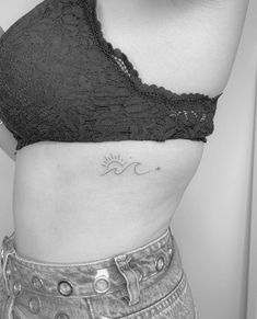 a woman with a tattoo on her stomach