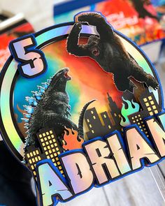 there is a sticker with an image of godzilla and the word dream on it