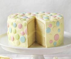 a cake that has been cut in half with polka dots on the top and sides