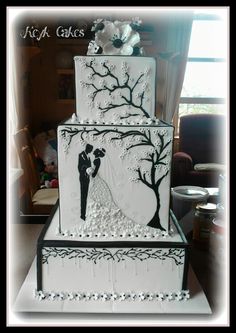 a wedding cake with an image of a bride and groom on it