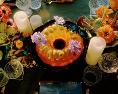 the table is set with candles and flowers