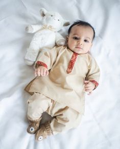 Adorable, made-to-order kurta for infants, toddler, and kid boys! MATCHING FATHER AND SON SETS ARE AVAILABLE ON OUR SHOP! Kurta ➤ Breathable and easy-to-wash cotton fabric ➤ Easy open and close clasp-buttons ➤ No-itch collar and sleeves ➤ Wide neck to easily fit over baby's head ➤ Options for plain or decorative sleeves and neckline Pajama / Pant / Trouser ➤ Breathable and easy-to-wash cotton fabric ➤ White to match with several kotis, kurtas and occasions ➤ Stretchable elastic waistband Choti K Baby Boy Kurta Design Cotton, Baby Boy Indian Ethnic Wear, Baby Boy Kurta Design Kids, Baby Boy Traditional Clothes Indian, Baby Boy Outfits Indian, Baby Boy Kurta Design, Baby Boy Ethnic Wear, Boys Kurta Design, Kids Kurta