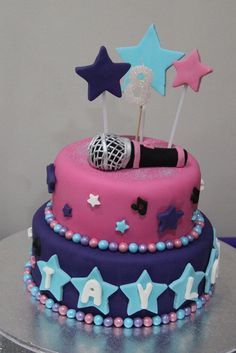 a pink and blue cake with stars on it