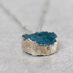 What a gem! Channel peace and tranquility, which the druzy stone represents, when you slip on the Chattan Geode Pendant Necklace. This necklace adds a touch of subtle shimmer, and is adjustable for comfort. Stones vary in shape and size, making each necklace a unique piece. Handcrafted in India by our fair trade partner Tara Projects, which helps to transform artisans' lives and communities with new opportunities to earn sustainable income. Silver Necklaces With Raw Stone In Mineral Crystal, Silver Necklace With Raw Stone And Mineral Crystal, Adjustable Crystal Necklace With Large Stone As Gift, Turquoise Mineral Crystal Necklace Gift, Adjustable Mineral Crystal Necklace With Raw Stone, Silver Meditation Jewelry With Raw Stone, Minimalist Adjustable Raw Stone Necklace, Adjustable Silver Necklace With Mineral Crystal, Adjustable Pendant Necklace With Raw Stone