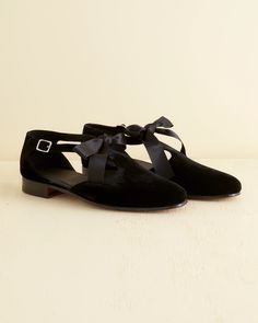 These shoes are inspired by dancing shoes from the midcentury. We reproduced the silhouette, with its T-strap detail and side buckle, in black velvet. The shoes can be styled with or without the satin ribbon. Runs small; size up one size 100% leather 100% viscose outer Made in Italy View all shoes   For additional quan