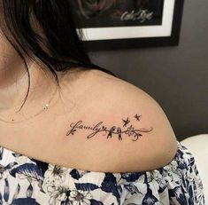 a woman with a tattoo on her shoulder