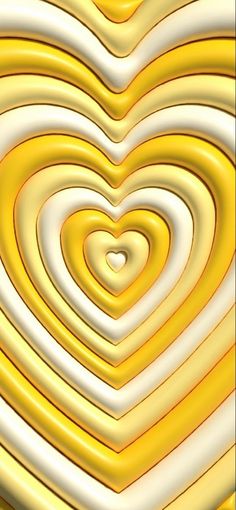 a heart shaped object is shown in yellow and white