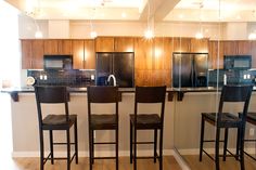 the kitchen is clean and ready to be used as a dining room or office space