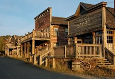 an old building with wooden balconies on the front and second story porchs