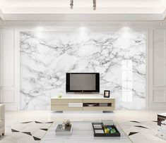 a living room with white marble walls and flooring, tv on the wall in center