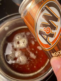 a can of root beer being filled with ice