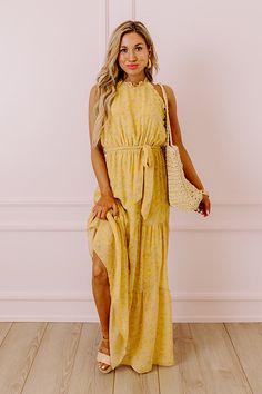 You are sure to feel nothing but happiness when you dress to impress in this beautiful primrose yellow colored maxi featuring lightweight flowy material patterned with a subtle floral print, a high neckline with a halter tie closure, ruffled trim detailing, a cinched waistline with a tie belt, and a relaxed tiered skirt silhouette that cascades into a straight ankle-length hemline! Measurements S : Bust 30", Hip 38", Length 54", Waist 26-28". M : Bust 32", Hip 40", Length 54", Waist 28-30". L : Casual Yellow Halter Neck Maxi Dress, Spring Yellow Halter Dress For Beach, Yellow Halter Dress For Spring Vacation, Yellow Halter Dress For Spring Beach Outing, Yellow Halter Dress For Spring Beach, Yellow Halter Dress For Beach Spring Season, Yellow Halter Dress For Spring Beach Occasion, Yellow Halter Neck Maxi Dress For Spring, Yellow Floral Print Halter Neck Maxi Dress