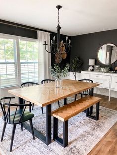 a dining room table with chairs and a bench