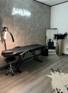 a hair salon with an ironing board and stool