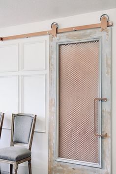 two chairs sitting next to each other in front of a sliding door