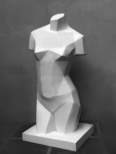 a white sculpture sitting on top of a table