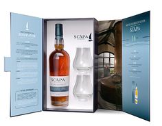 an open box containing two glasses and a bottle of scapa whisky in it