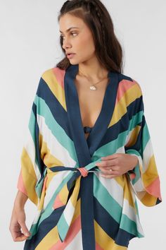 Elegant kimono style woven that features a longer length design, allover print and open front detail. O'Neill Women's woven kimono top 31 3/4" In length Relaxed fit Allover print 100% Viscose Moss Crepe Multicolor V-neck Kimono For Beachwear, Multicolor V-neck Kimono For Vacation, Multicolor V-neck Kimono For Beach Season, Multicolor Beach Robe With Kimono Sleeves, Multicolor Print Kimono With Vibrant Print And Kimono Sleeves, Multicolor V-neck Kimono For Loungewear, Beachwear Kimono With Kimono Sleeves For Daywear, Beachwear Kimono For Daywear, Daywear Kimono With Kimono Sleeves For Beach