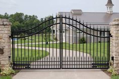 an iron gate in front of a house