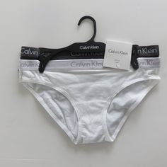 New With Tags Color Gray N White Tags 95% Cotton 5% Elastane Questions? Leave A Comment Below! Calvin Klein Seamless Swimwear For Summer, Calvin Klein Seamless Swimwear For Beach, Calvin Klein Summer Swimwear Briefs, White Cotton Briefs, Calvin Klein Thong, Calvin Klein Ck One, Calvin Klein Women, Calvin Klein Woman, Lace Thong