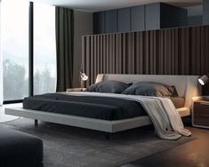 a modern bedroom with black walls and white bedding, along with a gray rug on the floor