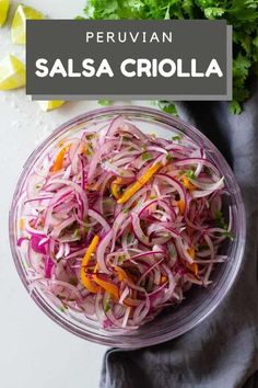 a glass bowl filled with sliced red onions and carrots next to cilantro