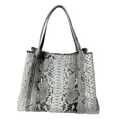 This is a new tote bag by Raviani. It is made in natural color python leather leather. This bag is fully lined with many zipper pockets, center pocket & 2 hidden pockets. This bag has top zipper closure, also has flap with magnetic snap. This bag can be made in many colors. Please contact us Measurements: 17'' W x 13'' H x 8'' D Leather Tote Bag With Snake Print, Luxury Snake Print Shoulder Bag For Everyday, Everyday Use Top Handle Shoulder Bag With Snake Print, Luxury Snake Print Bag For Everyday Use, Elegant Snake Print Tote Bag, Everyday Top Handle Snake Print Bag, Everyday Use Snake Print Top Handle Bag, Everyday Snake Print Top Handle Bag, Leather Tote Shoulder Bag With Snake Print