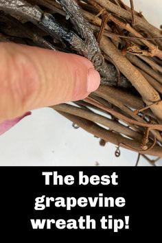 the best grapevine wreath tip is shown in front of a hand pointing at it