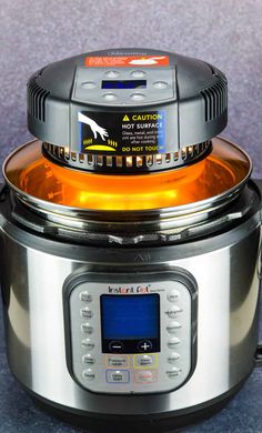 an electric pressure cooker with the lid open