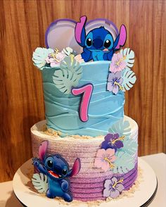 the birthday cake is decorated with an image of stitcher and lili from disney's movie