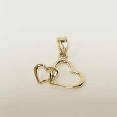 "Thanks for shopping our vintage estate store. We tend to sell well below wholesale and truly hope you enjoy all of our items. Many of the items are one of a kind, so please enjoy scrolling through the pictures and hopefully something will catch your eye. Spot are from reflections or camera. Beautiful estate 14k yellow gold heart to heart charm pendant.  Size: 1/2\" by 5/8\" Weight: .56 gram Bail: 2mm Beautiful and sweet pendant or charm, marked 14k yellow gold." 14k Stamped Double Heart Necklace For Anniversary, 14k Double Heart Necklace For Anniversary, 14k Gold Double Heart Anniversary Necklace, Double Heart 14k Stamped Necklace For Anniversary, 14k Stamped Double Heart Jewelry For Valentine's Day, Double Heart Hallmarked Necklace For Anniversary, Valentine's Day 14k Stamped Double Heart Jewelry, Double Heart 14k Stamped Anniversary Necklace, Yellow Gold Double Heart Necklace Hallmarked