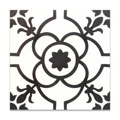 a black and white tile with an ornate design