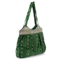 Store your essentials inside this one-of-a-kind bag. Crafted from antique silk sari, this accessory is rich in details. A gorgeous brocade pattern and a green hue give this bag an eclectic vibe. • Antique Silk Sari with Brocade Silk • 100% Silk with Cotton Lining • Green/Gold • 45 centimeters in length x 71 centimeters in width Batwa Bags, Brocade Pattern, Bag Tutorials, Fabric Paint Designs, Potli Bag, Recycled Sari Silk, Silk Bag, Diy Bags, Potli Bags