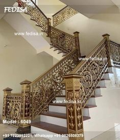 an ornate stair case with wooden handrails