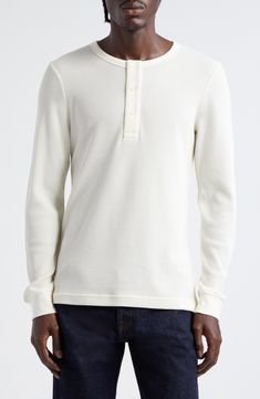 A breathable waffle weave brings soft texture to this long-sleeve henley crafted in a regular fit to keep the look comfortable and easygoing. 28" Length (Size Medium) Button half-placket Crewneck Long sleeves with ribbed cuffs 100% cotton Machine wash, dry flat Made in Portugal Designer Clothing Classic Long Sleeve Henley For Spring, Cream Long Sleeve Waffle Knit Top, Cream Waffle Knit Long Sleeve Top, White Cotton Henley For Fall, Fall Waffle Knit Henley With Henley Neckline, Fall Waffle Knit Henley, Everyday Long Sleeve Henley With Button Closure, Casual Long Sleeve Ribbed Henley, Casual Ribbed Long Sleeve Henley