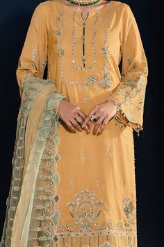 Dusty Yellow Embellished Pakistani Salwar Kameez Dupatta is artfully enriched with contrasted embroidery, hand adda embellishments, crystal like buttons. Dusty Yellow, Embroidery Suits Punjabi, Suits Punjabi, Pakistani Salwar, Pakistani Salwar Kameez, Embroidery Neck Designs, Embroidery Hand, Boutique Dress Designs, Indian Suits