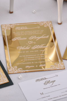 the wedding stationery is laid out on the table